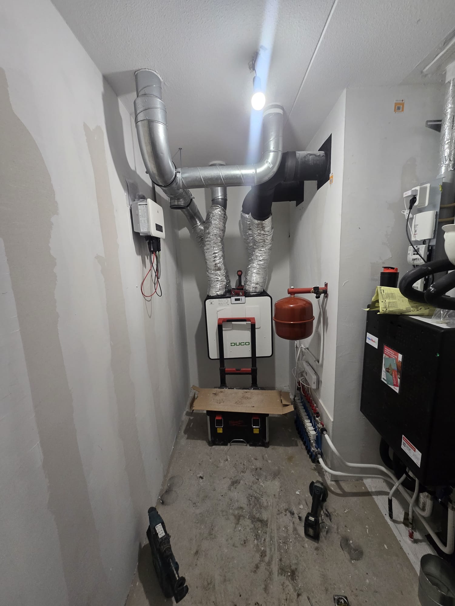Mechanical ventilation system with heat recovery installed in a utility room.
