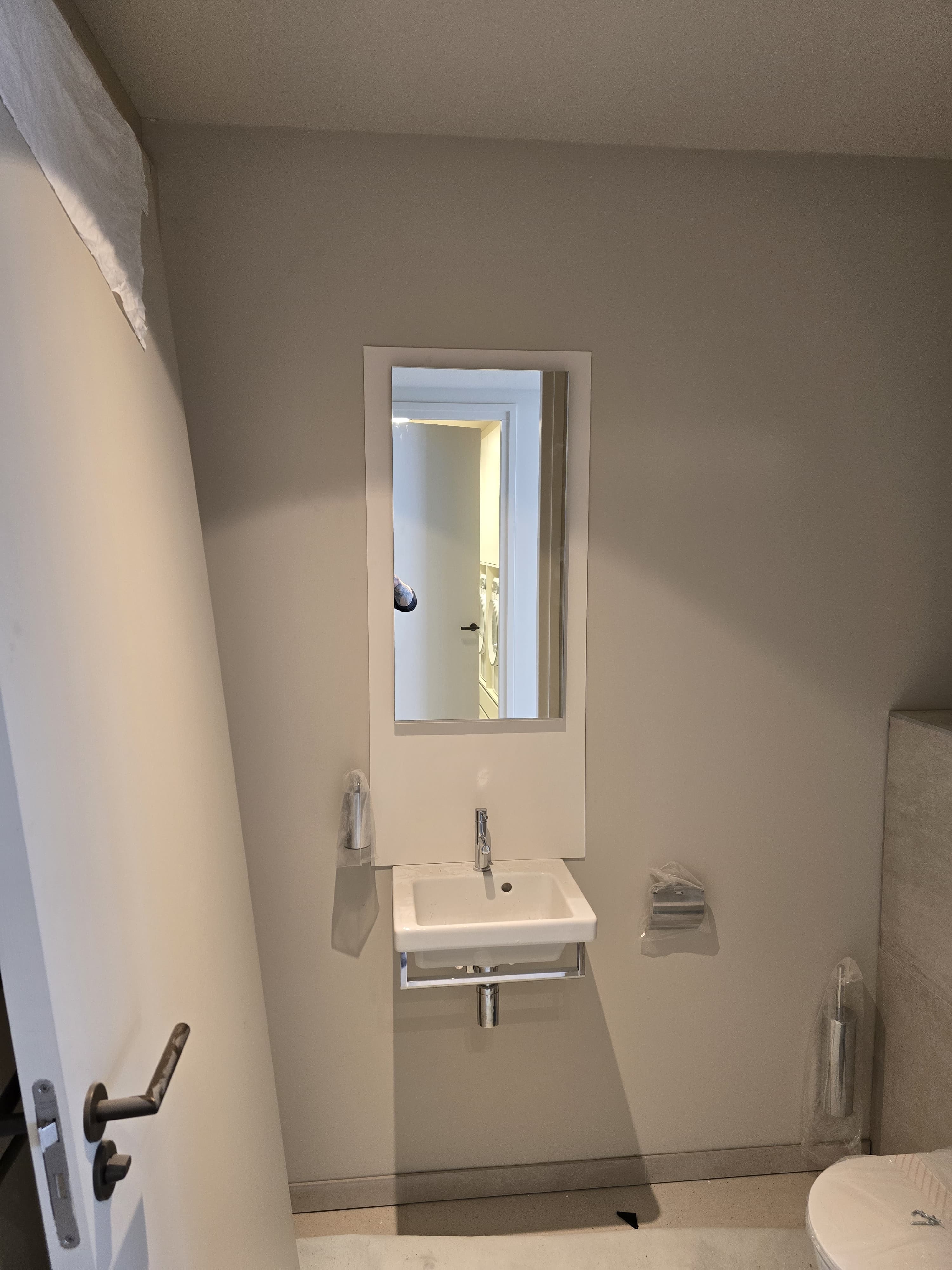 Expertly fitted sink and mirror, ensuring durability and functionality.